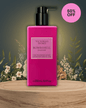Victoria’s Secret Bombshell Passion lotion bottle with romantic Paris rooftop and iconic Eiffel Tower background at sunset