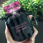 Victoria's Secret Bombshell New York Eau de Parfum bottle with sleek black dress and NYC skyline background
