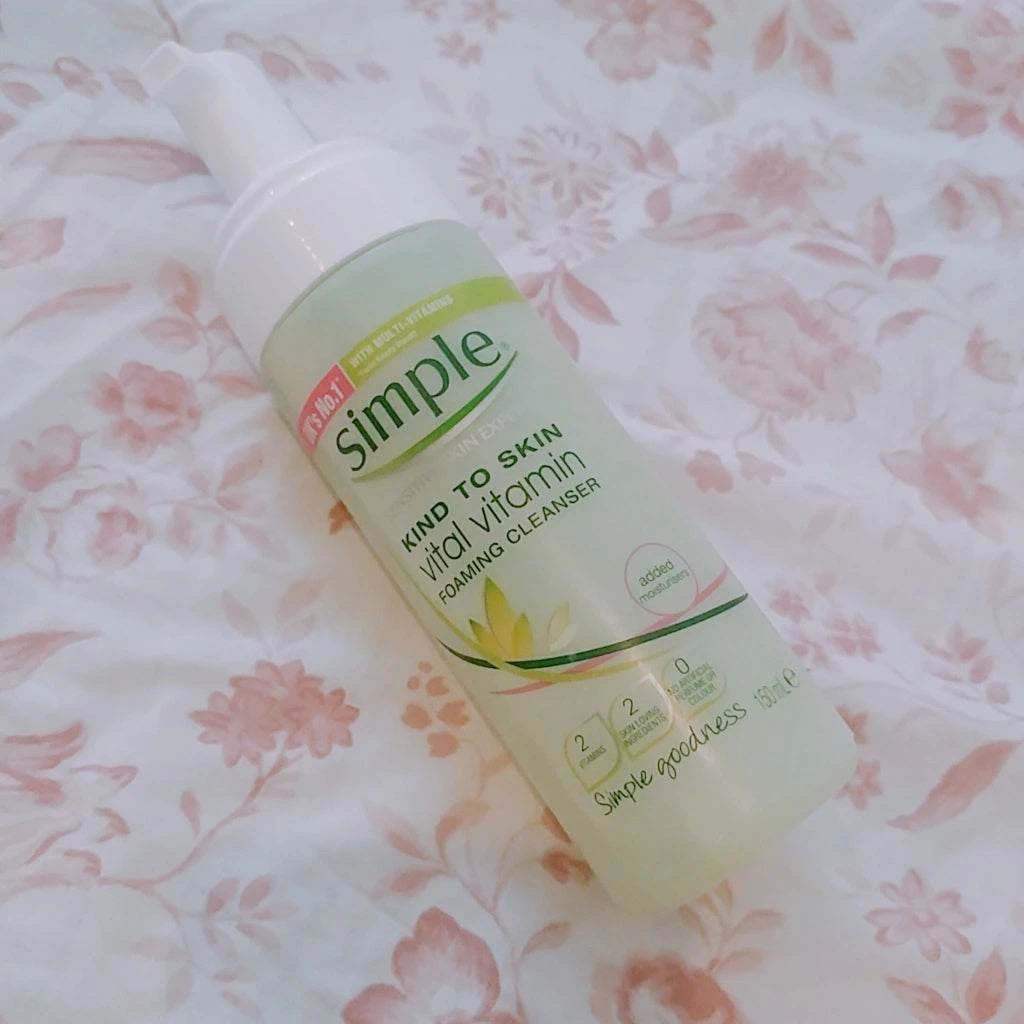 Simple Kind to Skin Vital Vitamin Foaming Cleanser bottle with foaming pump on white background